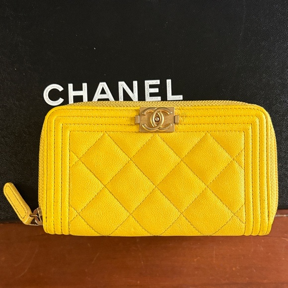 CHANEL Handbags - CHANEL Boy Vibrant Yellow Cavier Quilted zippy Wallet with gold tone hardware
